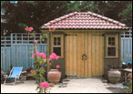 Home Studio with clay tile roofing