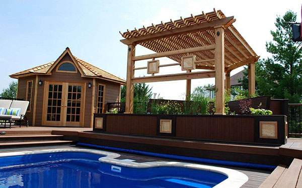 Stunning poolside covered sitting area and trellis. ID number 115604