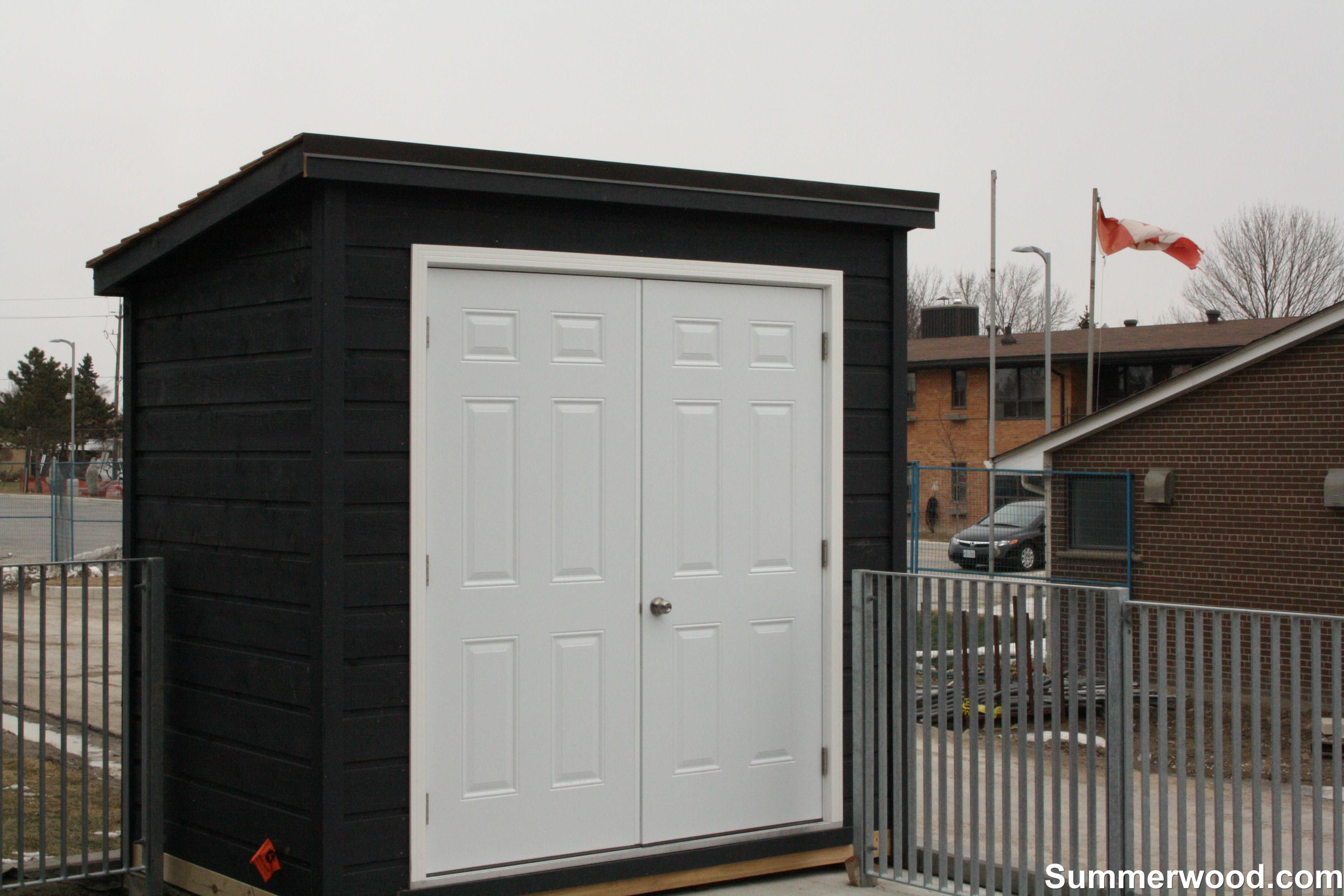 Black Sarawak shed 6x10 with metal double doors in Etobicoke, Ontario. ID number 176702.