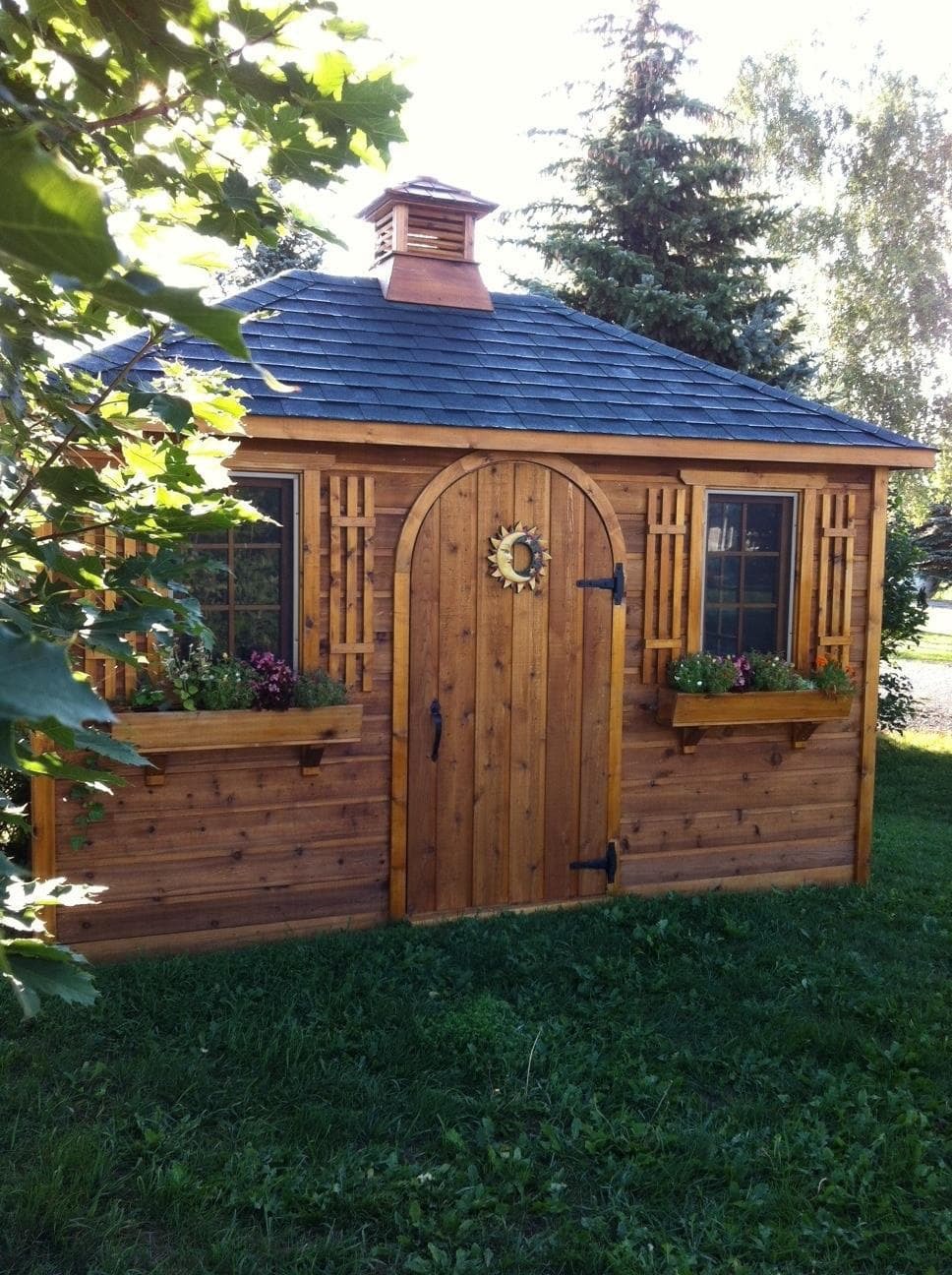 Cedar Sonoma 8 X12 cabin with antique flower boxes in Brooklin Ontario. ID number 223823-6