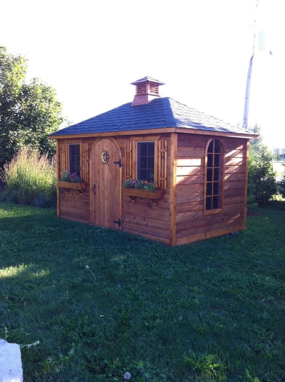 Cedar Sonoma 8 X12 cabin with antique flower boxes in Brooklin Ontario. ID number 223823-4