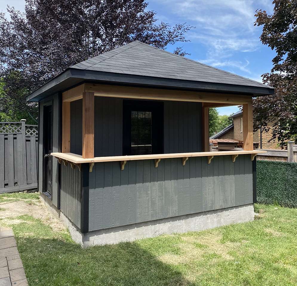 Front view of an 12’ x 12’ Barside Pool Cabana located in Aurora, Ontario – Summerwood Product