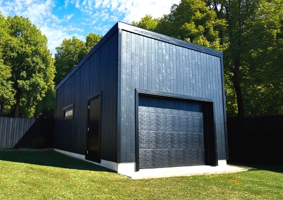 Backyard Man Cave - Outside View of a Black Siding Modern Garage With One Door - Prefab kit