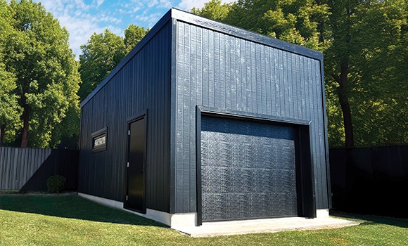 Backyard Man Cave - Outside View of a Black Siding Modern Garage With One Door - Prefab kit