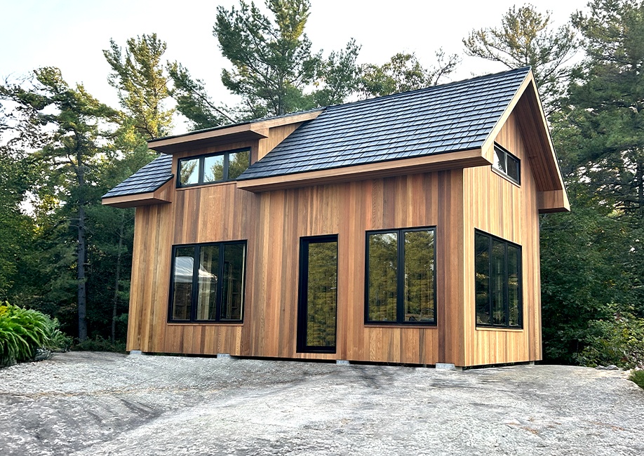 Backyard Man Cave - Outside View of a Black Siding Modern Garage With One Door - Prefab kit