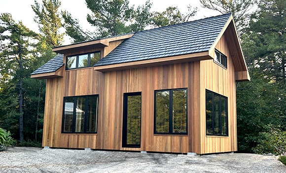 Backyard Man Cave - Outside View of a Black Siding Modern Garage With One Door - Prefab kit